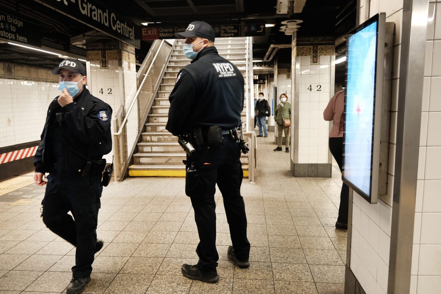 Police search for a suspect in a Times Square subway station following a call to police from riders on April 25, 2022 in New York City.