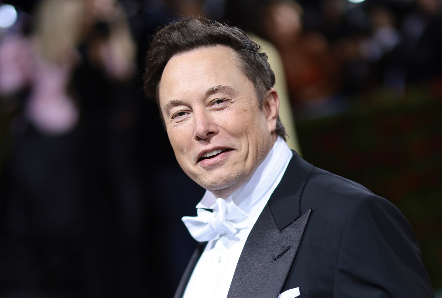 Elon Musk is seen wearing a tuxedo on the red carpet at the 2022 Met Gala.