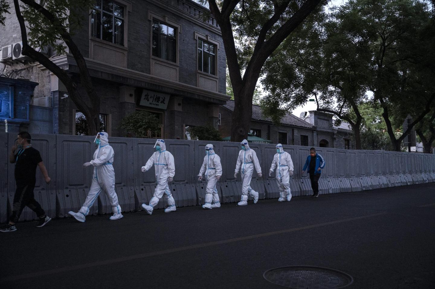 Health workers in protective clothing in Beijing