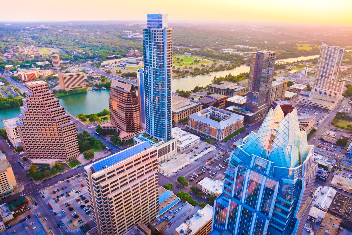 Austin Texas skyscrapers skyline aerial at sunset from helicopter