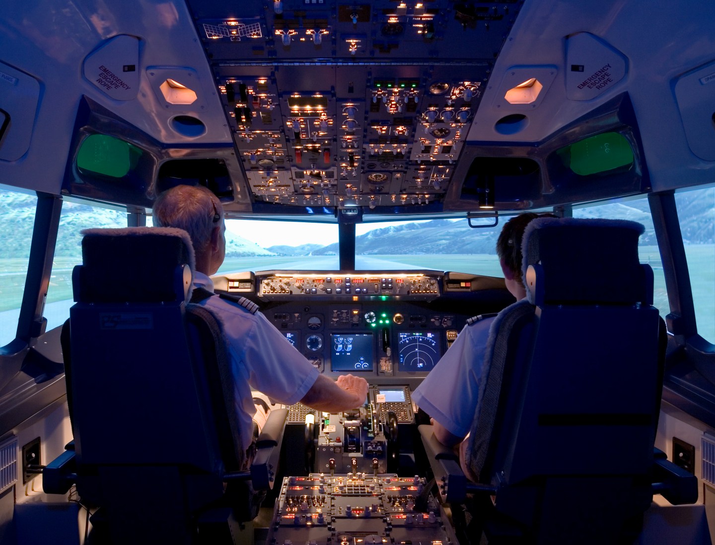 Pilots sitting in a flight simulator