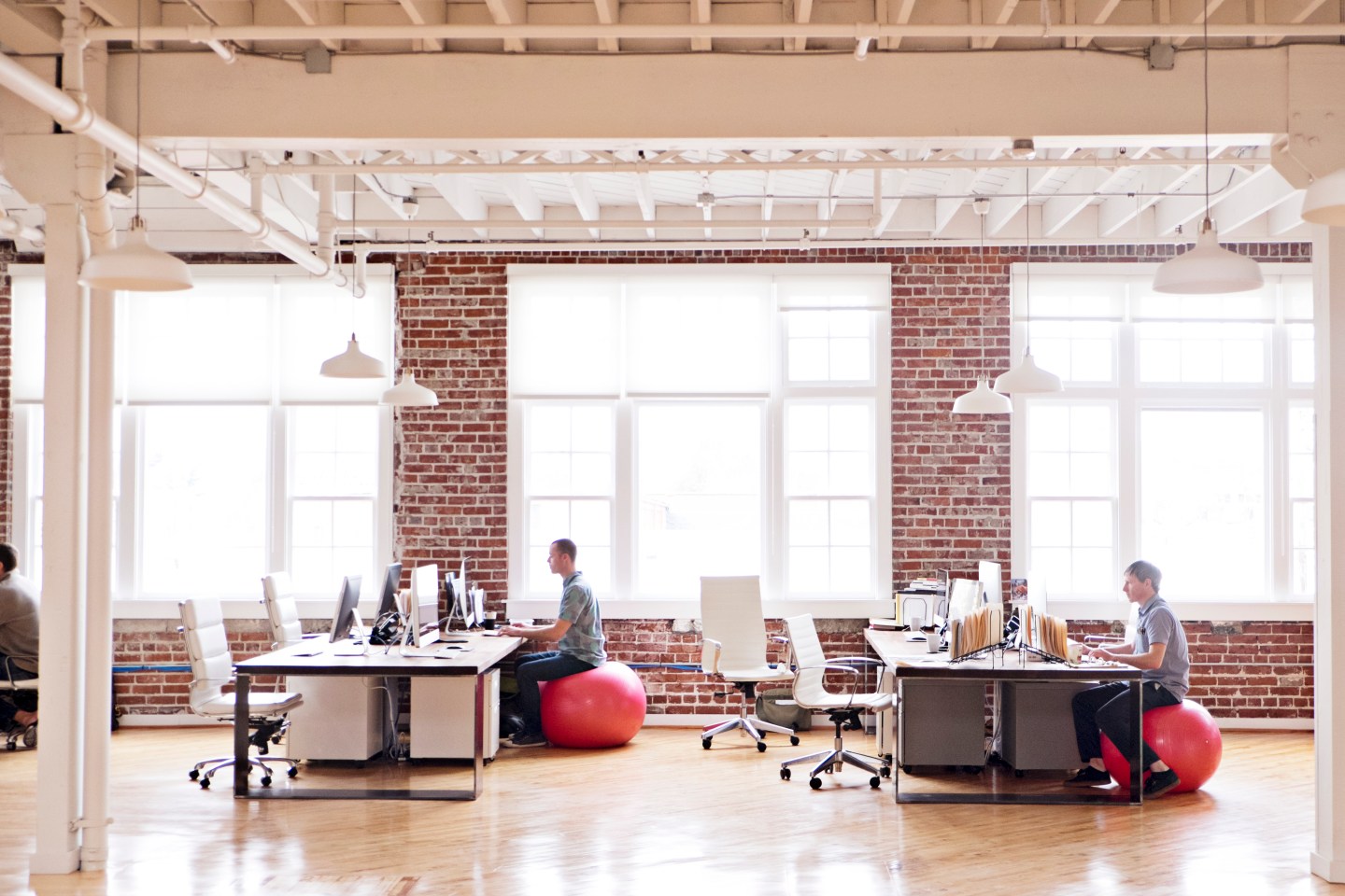View of people working in an open-plan office