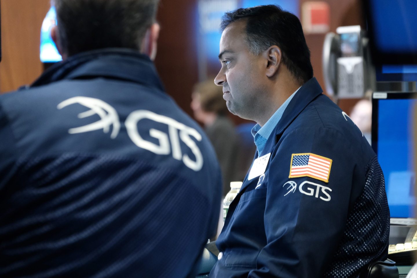 A NYSE trader works the trading floor.