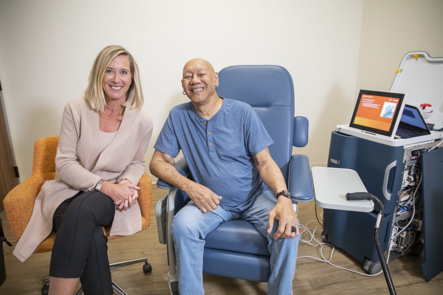 Leslie Trigg with a patient using the Tablo dialysis machine.