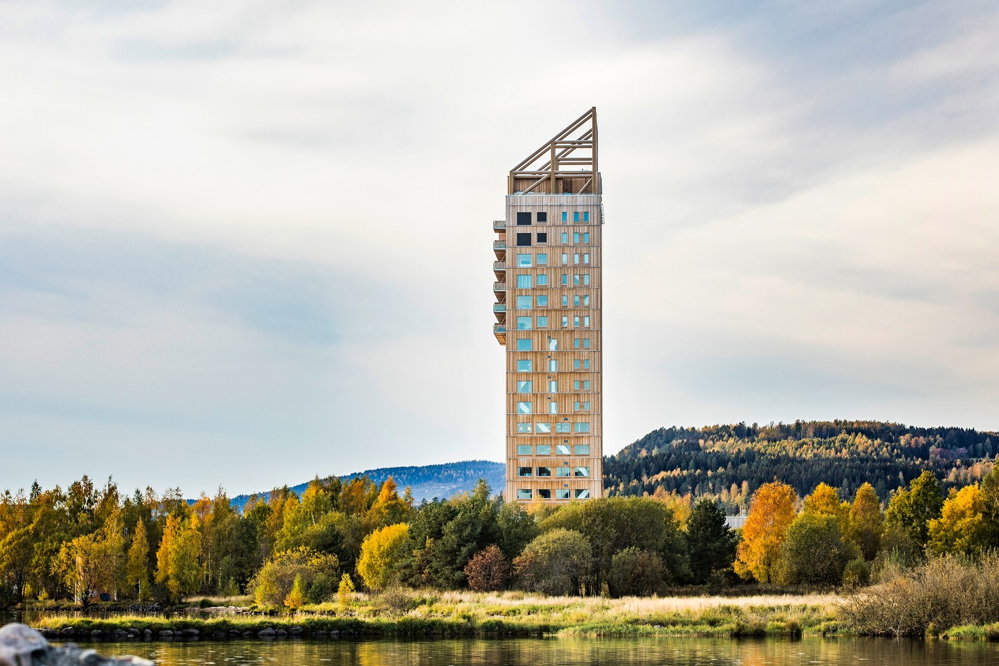 Exterior of Voll Arkitekter's Mjøstårnet timber building, which includes a hotel, office spaces and apartments.