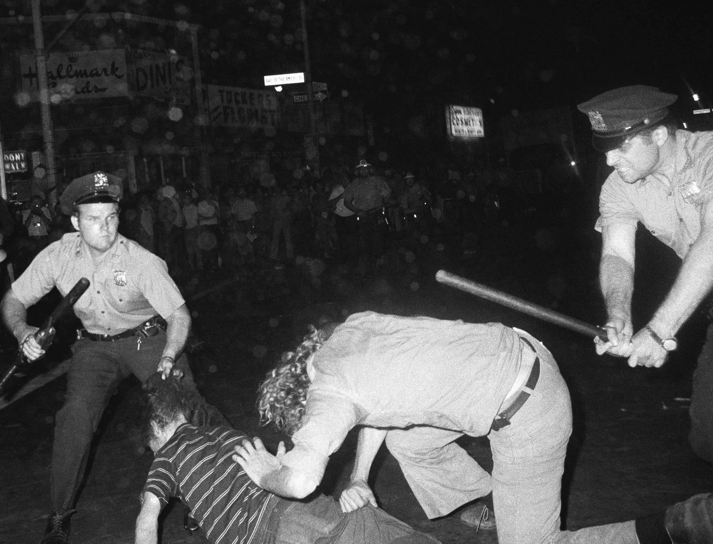 In this Aug. 31,1970, file photo, an NYPD officer grabs a youth by the hair as another officer clubs a young man during a confrontation in Greenwich Village after a Gay Power march in New York. Parades celebrating LGBTQ pride kick off in some of America's biggest cities Sunday amid new fears about the potential erosion of freedoms won through decades of activism. The annual marches in New York, San Francisco, Chicago and elsewhere take place just two days after one conservative justice on the Supreme Court signaled, in a ruling on abortion, that the court should reconsider the right to same-sex marriage recognized in 2015.