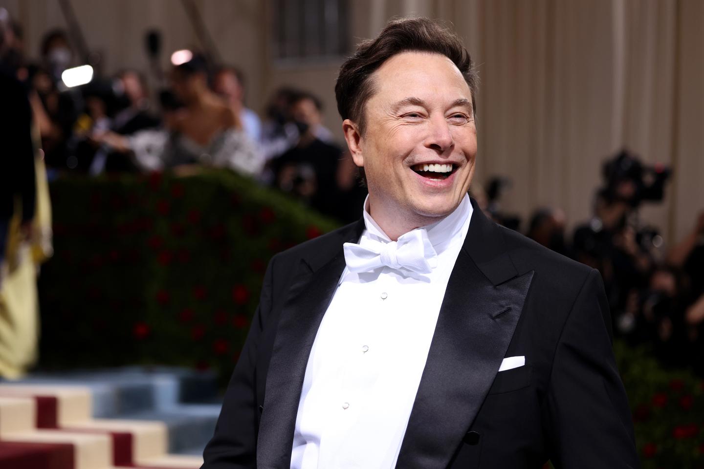 Elon Musk laughs at the 2022 Met Gala.