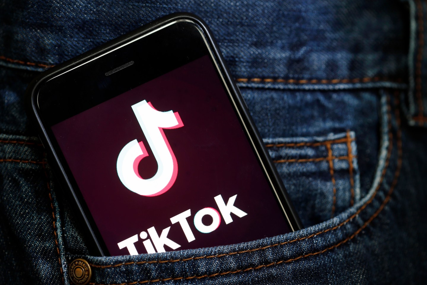 In this photo illustration, the social media application logo, Tik Tok is displayed on the screen of an iPhone on March 05, 2019 in Paris, France.