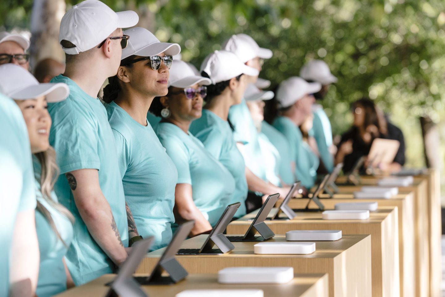Employees stand at check-in kiosks ahead of an Apple event at the Steve Jobs Theater in Cupertino, Calif., on Sept. 10, 2019.