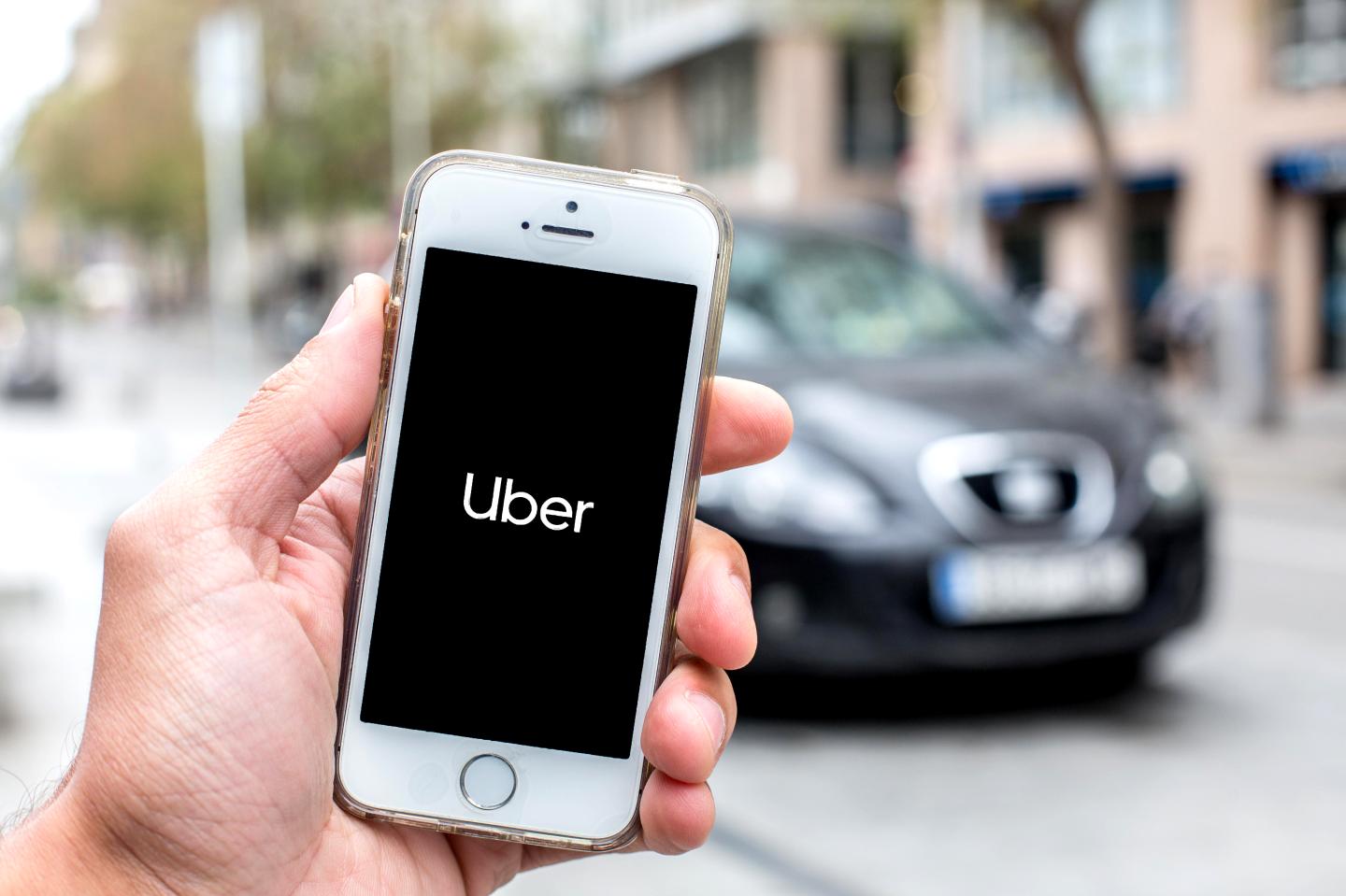 A phone with the Uber logo