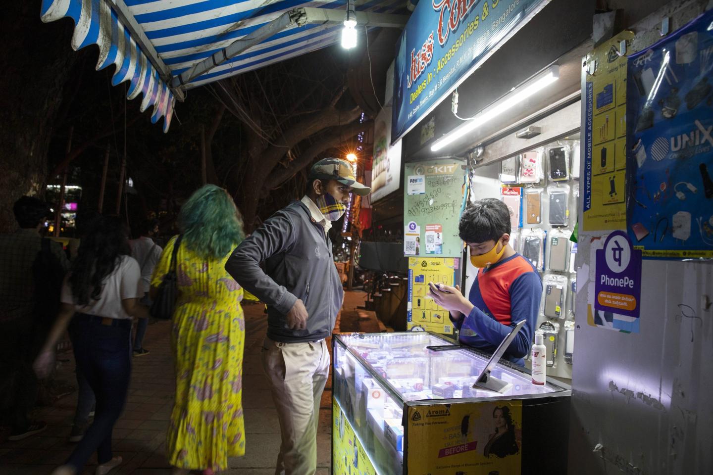 A customer at a mobile phone store in Bengalaru, India.