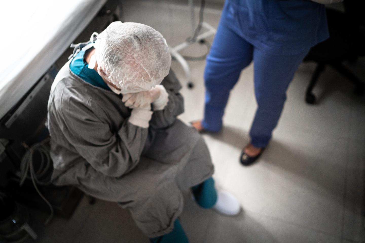 Worried healthcare worker at operating room in hospital
