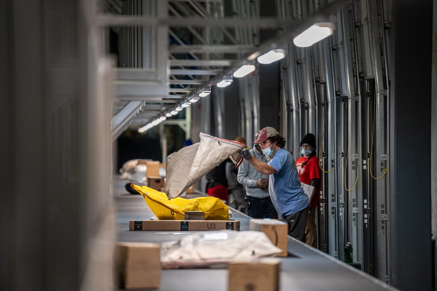 Workers at a partially automated 1-million-square-foot UPS facility in in Louisville, Ky.