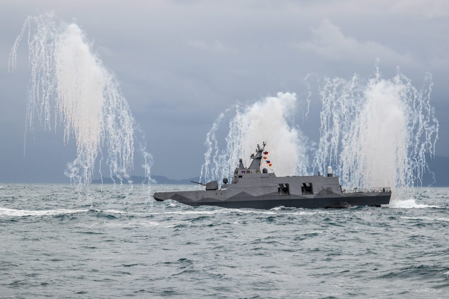 A Taiwanese military corvette fires flares, during a Navy Drill for Preparedness Enhancement ahead of the Chinese New Year, amid escalating Chinese threats to the island, in Keelung, Taiwan, Jan. 7. With the US approving an increasing number of arms sales to Taipei and China sending more PLA warplanes to cruise around the self governing island, military tensions in the Taiwan Strait have been expected to grow.
