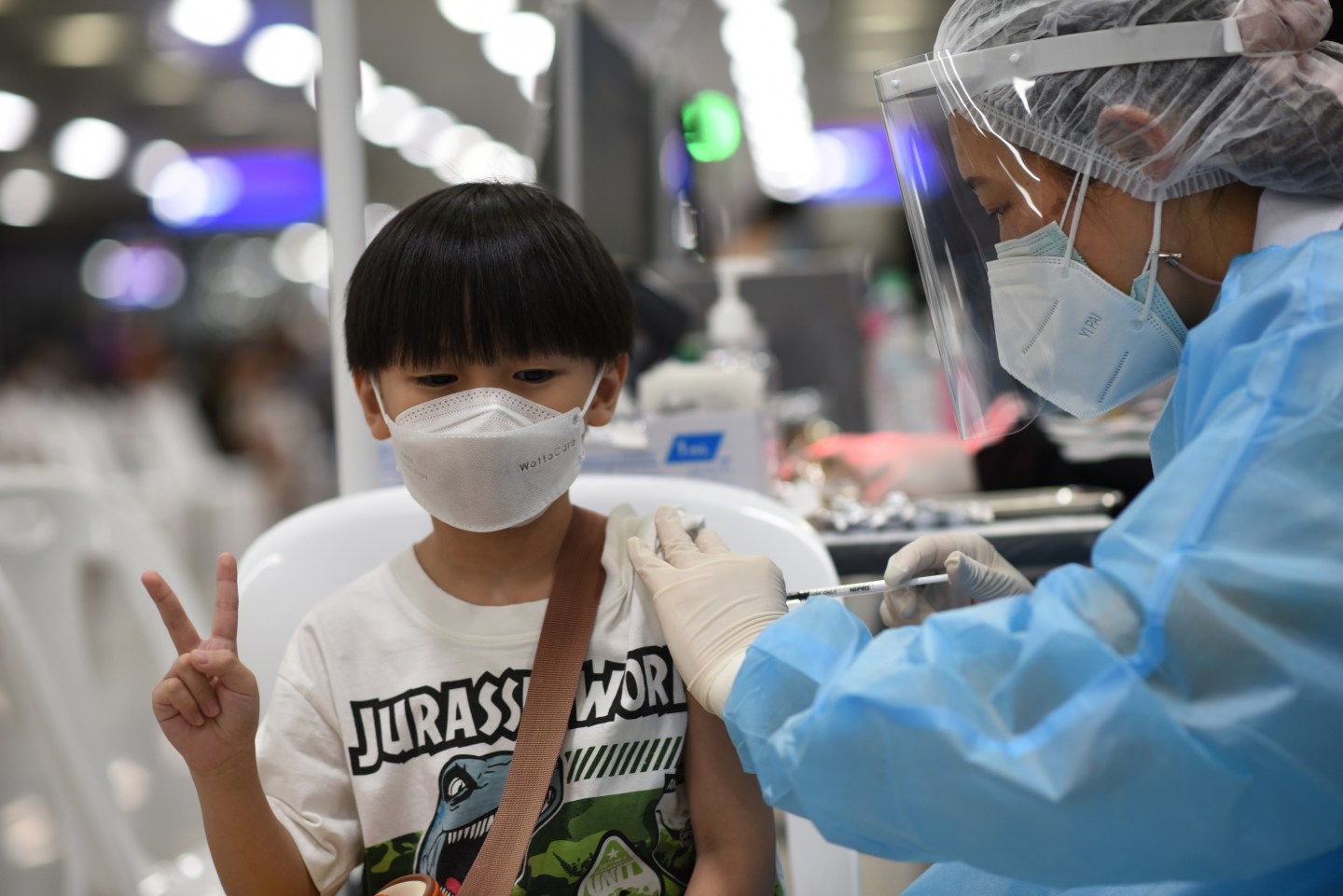 A young boy receives his first dose of the COVID-19 vaccine in Thailand on Feb. 16.