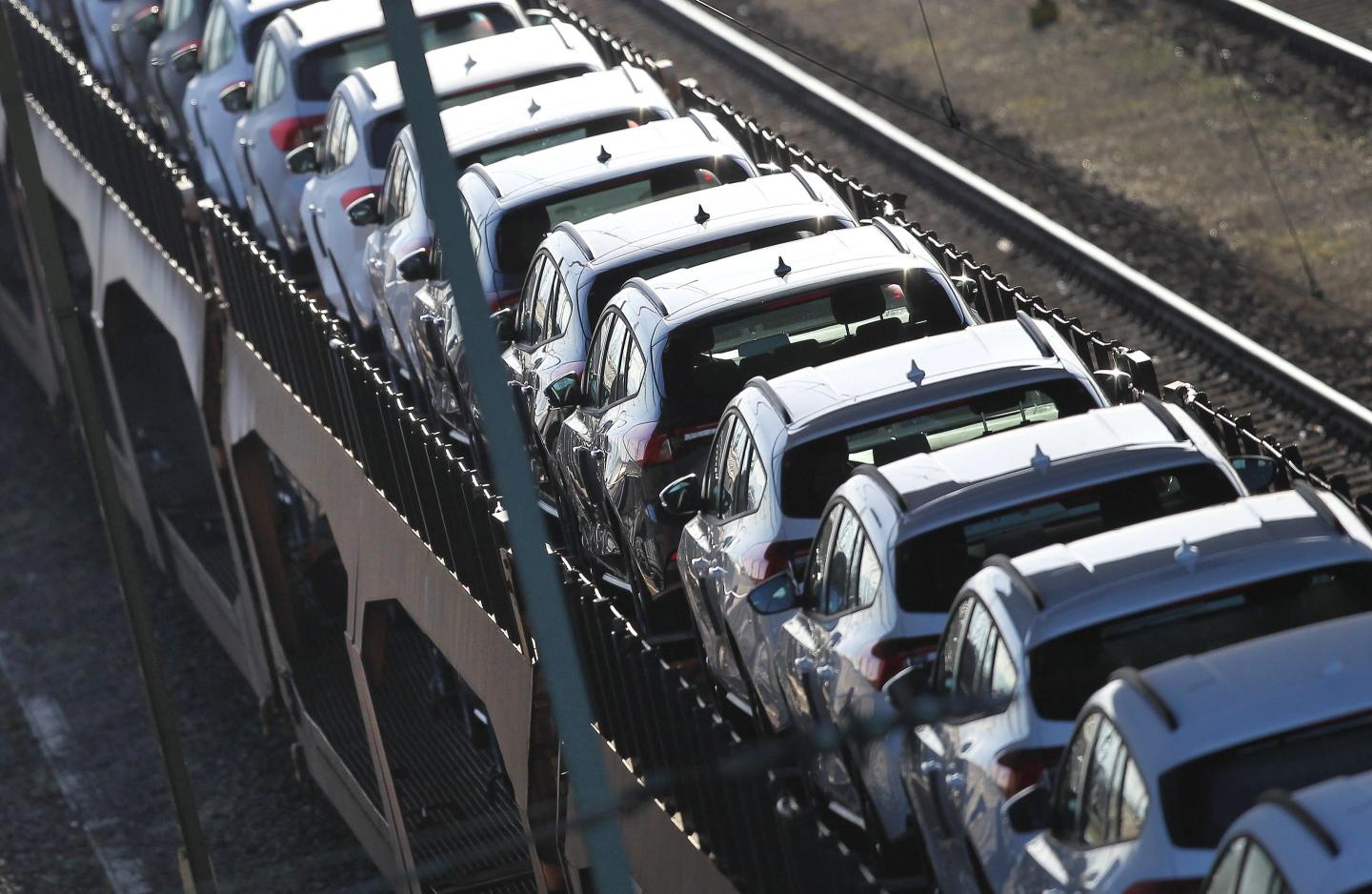 Cars being transported on a freight train at a depot in Germany