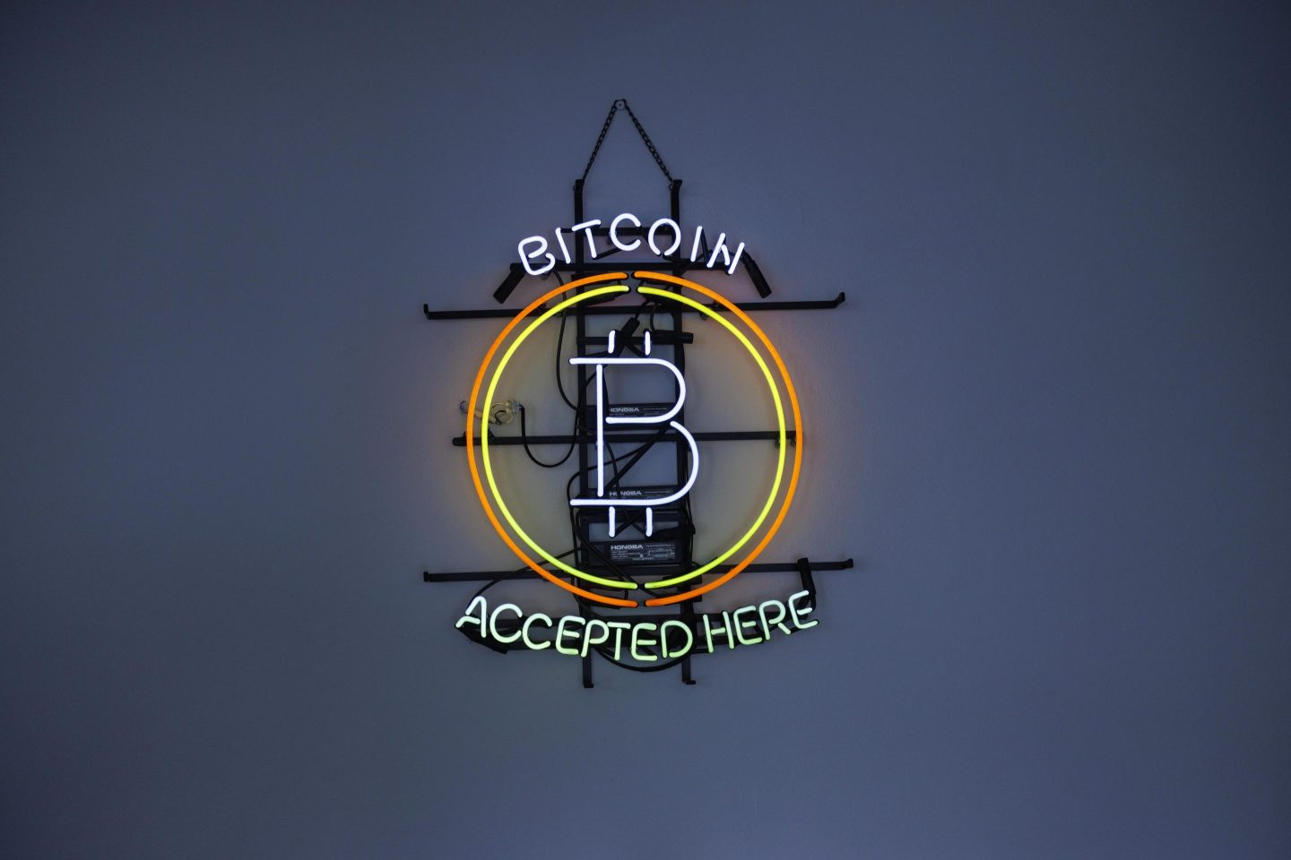 Neon sign reading “Bitcoin accepted here”