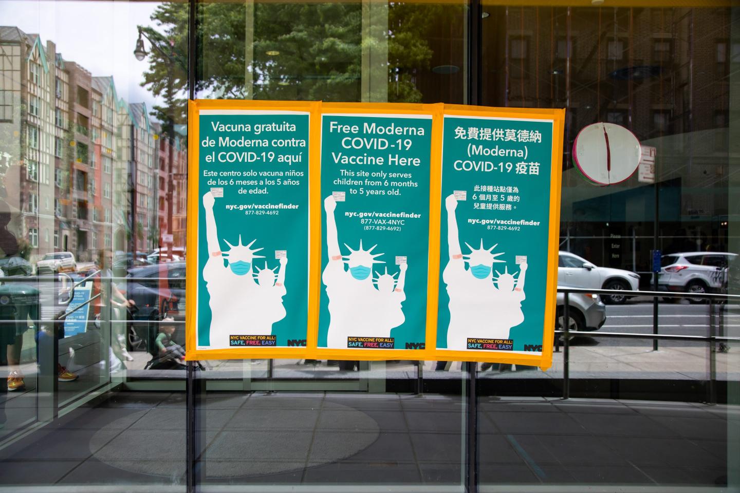 A sign advertising free Moderna vaccines for young children in New York