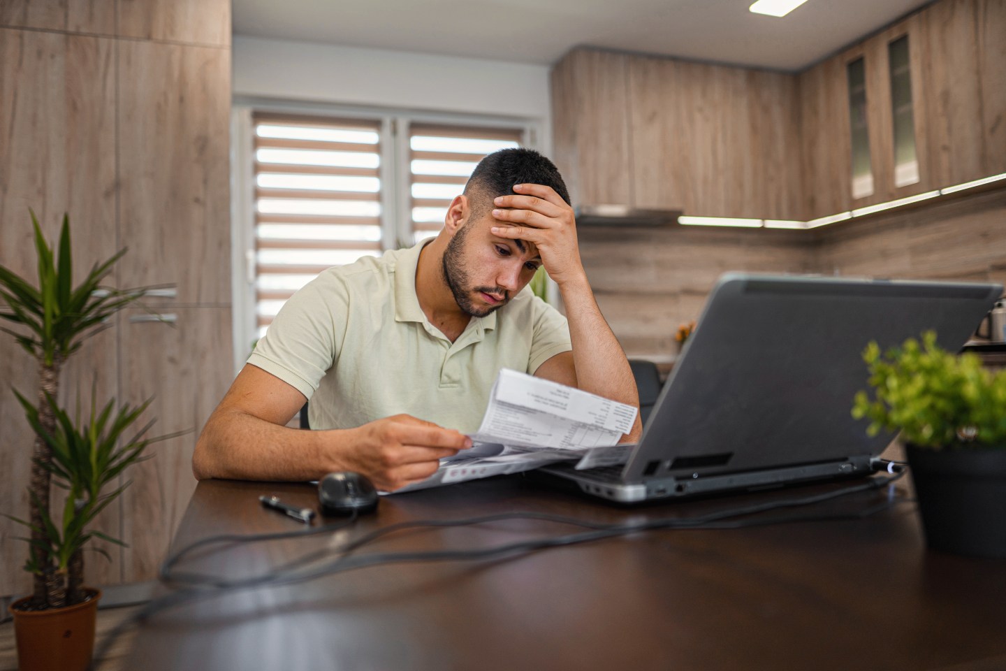 Man doing paperwork at home.