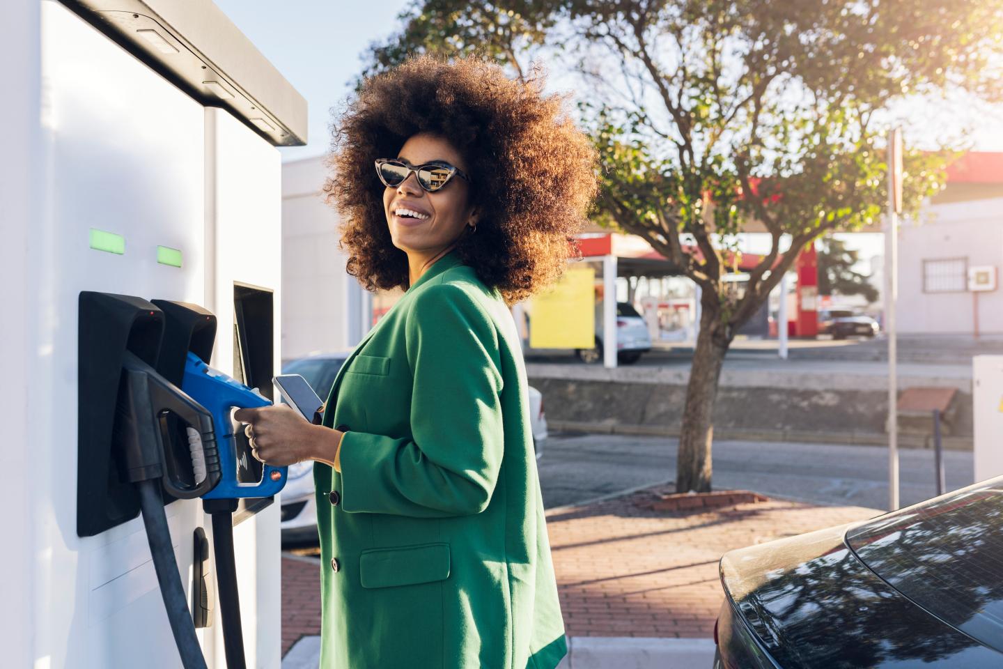 A woman at a gas station.