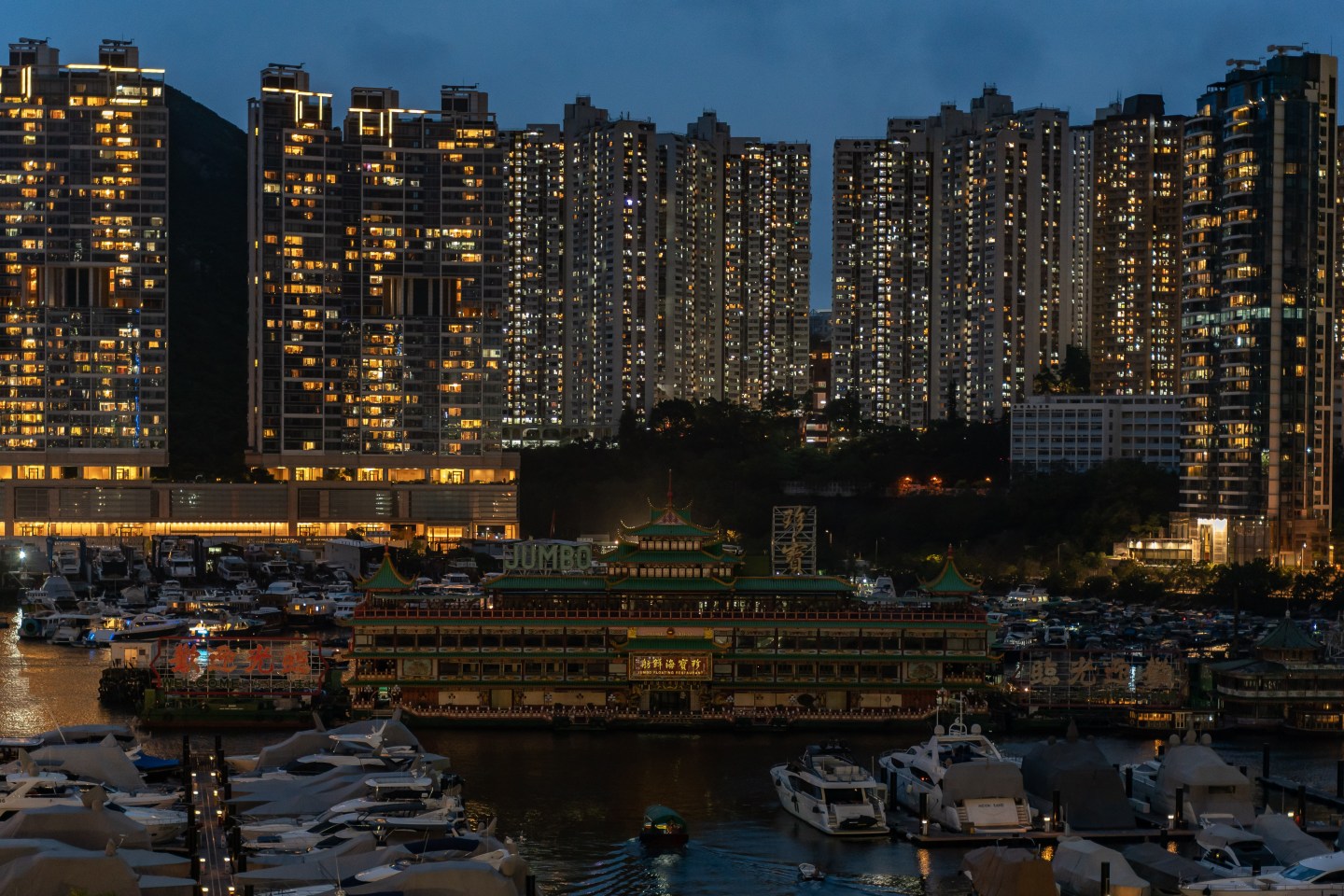 The Chinese imperial-style Jumbo Floating Restaurant is seen at a typhoon shelter in Aberdeen on June 13 in Hong Kong, China. The iconic Jumbo Floating Restaurant in Hong Kong is set to depart the city, amid a lack of funds to maintain the restaurant following months of COVID-19 restrictions.