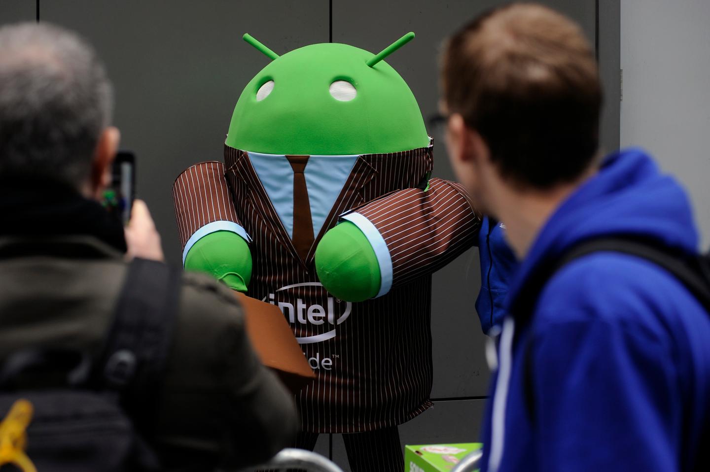 Google's green Android mascot wears a suit