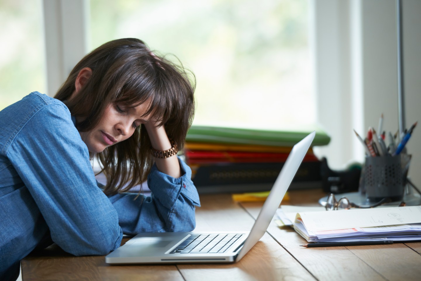 stressed woman at a laptop