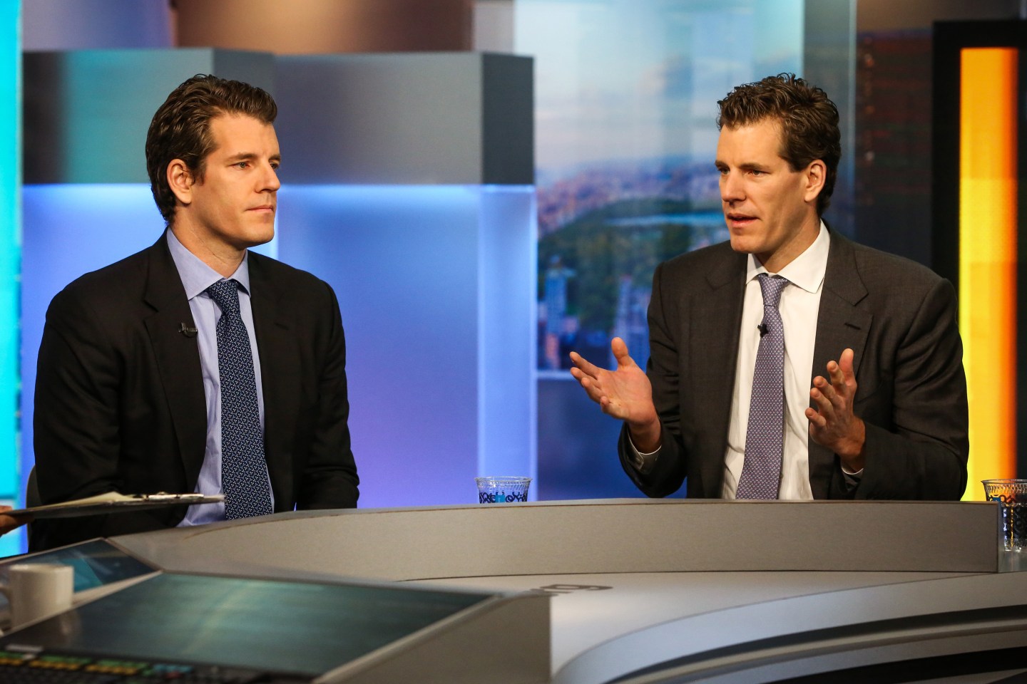 Cameron Winklevoss, president and cofounder of Gemini, right, speaks as Tyler Winklevoss, chief executive officer and cofounder of Gemini, listens