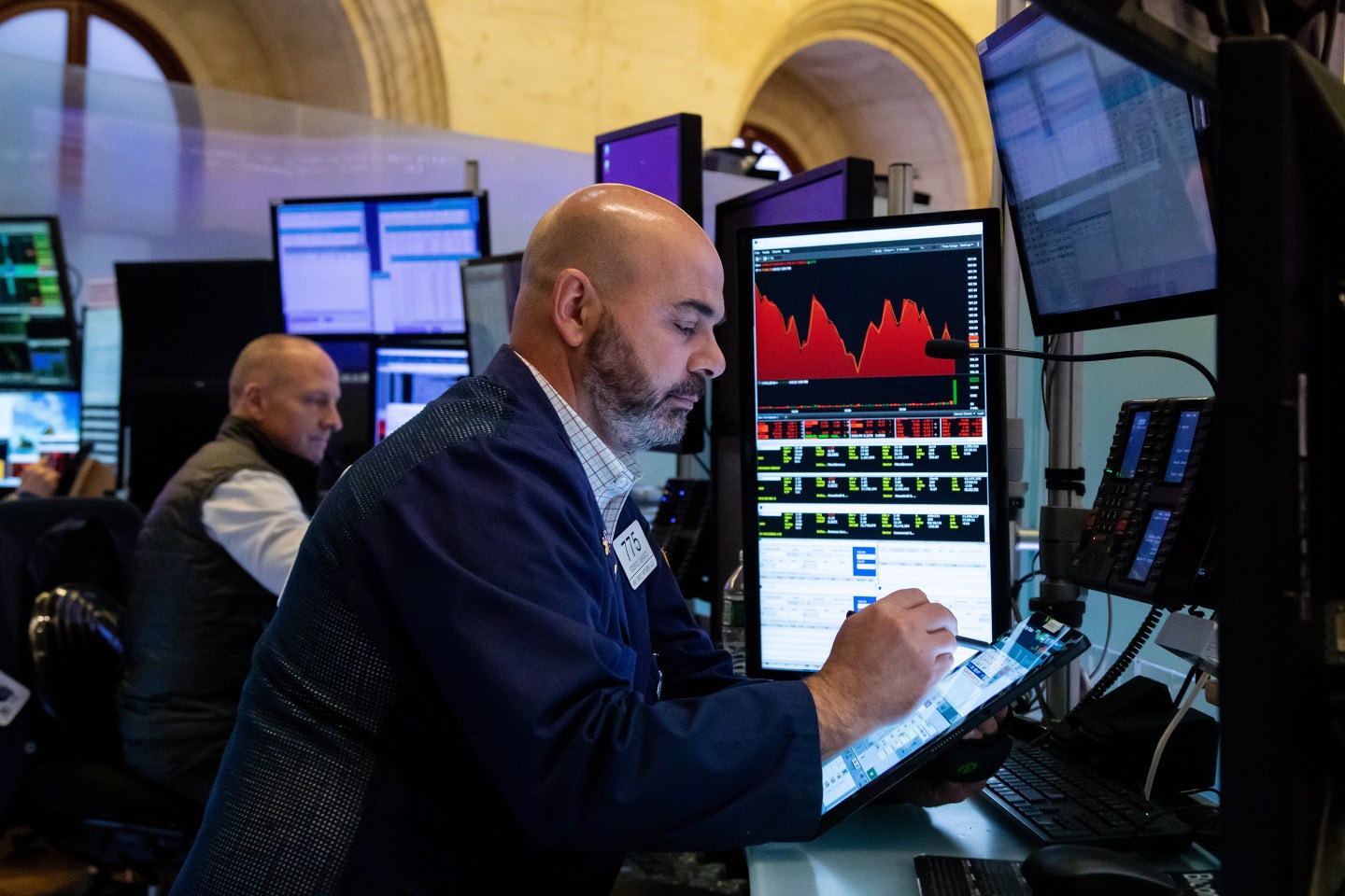 Traders work on the floor of the New York Stock Exchange