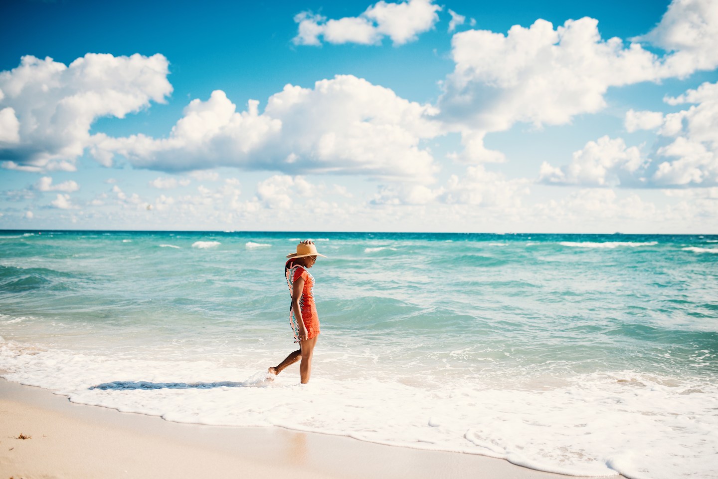 Portrait of beautiful Hispanic woman in bikini at the beach