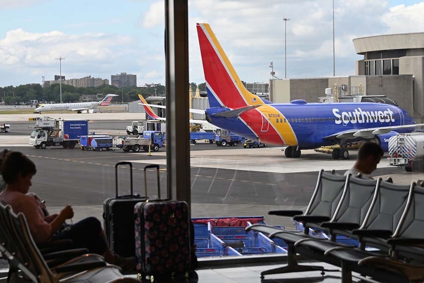 Passengers wait at the gate for a Southwest flight