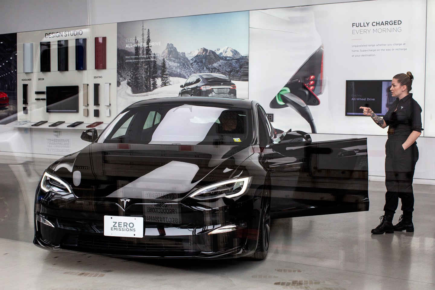 Tesla employee talks to a customer inside Tesla's showroom in New York City.