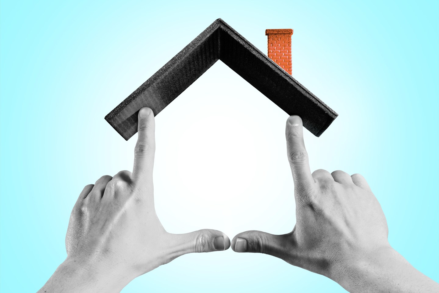 Hands making house shape