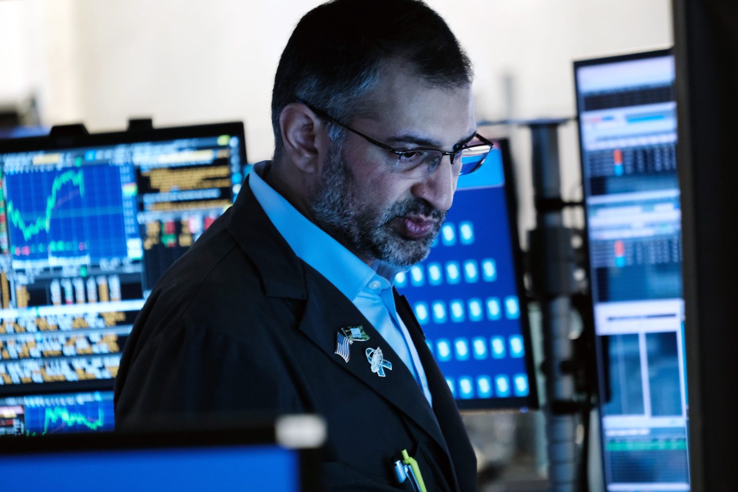 An NYSE trader looks at his computer.