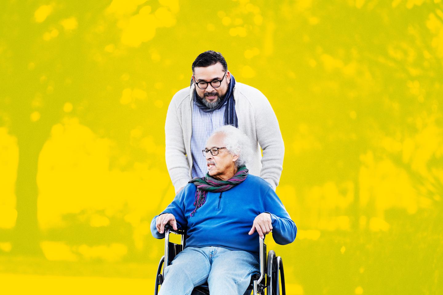 Senior man in wheelchair, with adult son