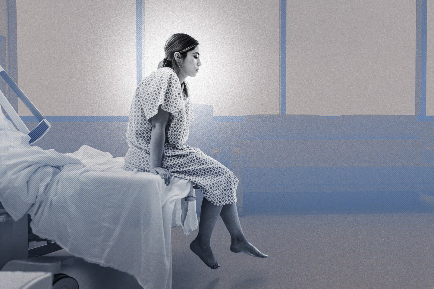 The female patient sits alone in the hospital room waiting on the doctor.