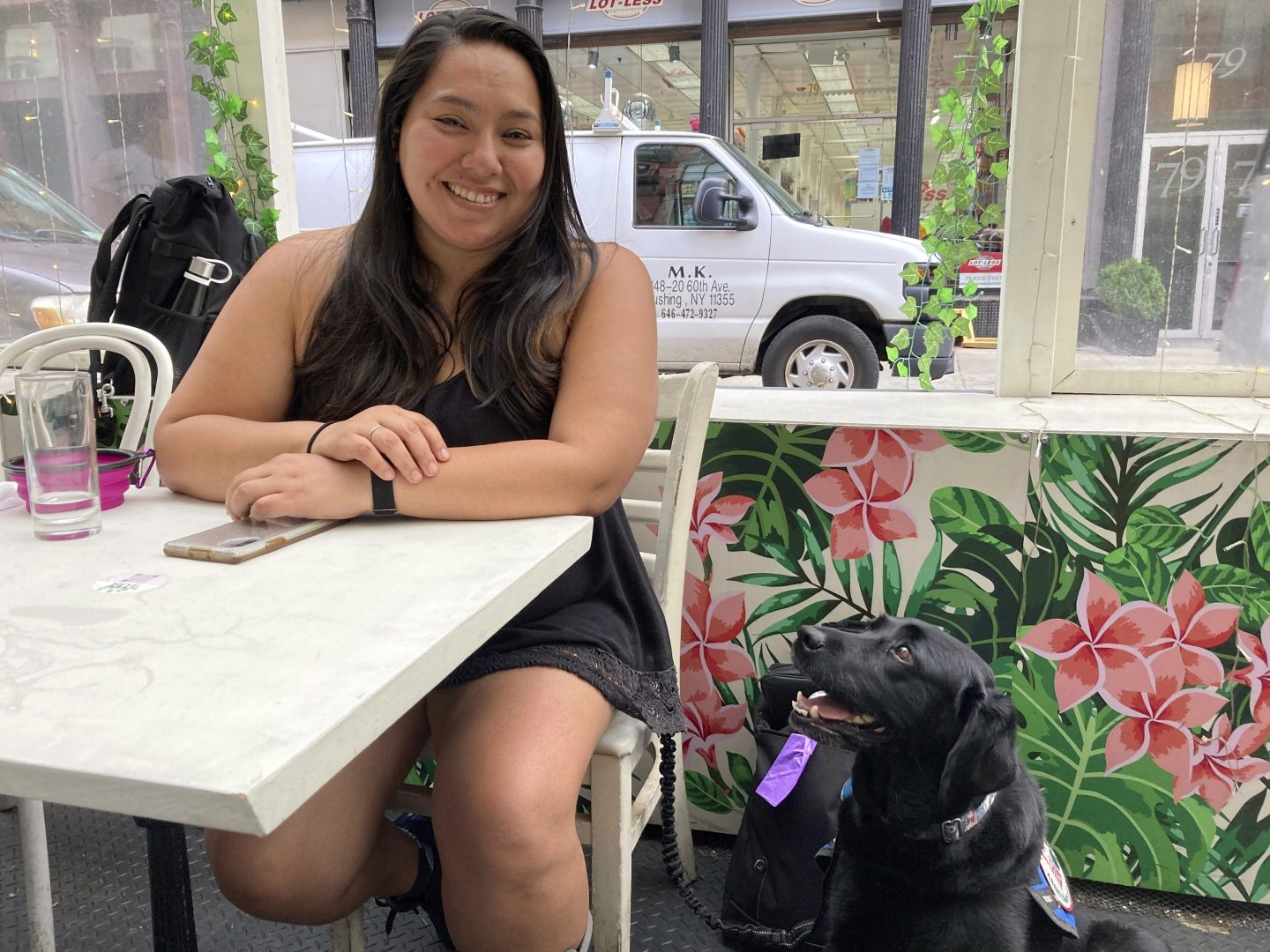 Mary Tardif, of Manhattan, sits with her service dog, Daisy, Friday, July 1, 2022, in New York, after a Manhattan federal court jury awarded her $431,250 after finding in her favor in a lawsuit she brought against New York City and its police department for injuries she suffered when she served as a medic for protesters at Occupy Wall Street events in 2012.