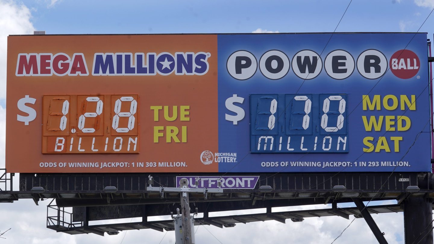 A sign displays the Mega Millions lottery jackpot in Detroit on Friday, July 29. The Mega Millions lottery jackpot keeps getting larger as officials raised the massive prize to $1.28 billion on Friday, just hours before the next drawing.