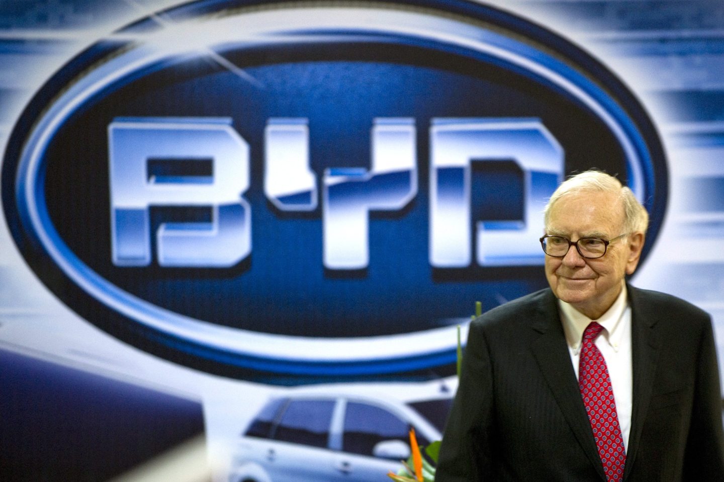 Warren Buffett, chairman of Berkshire Hathaway, attends a BYD news conference in Changsha, China, on Sept. 30, 2010. Berkshire owns a stake in the Chinese EV maker, which just surpassed Tesla in global EV sales.