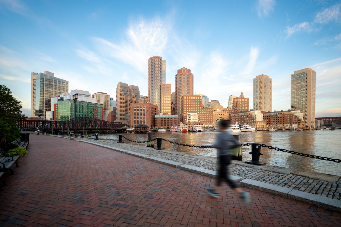 Woman jogging near Boston harbor