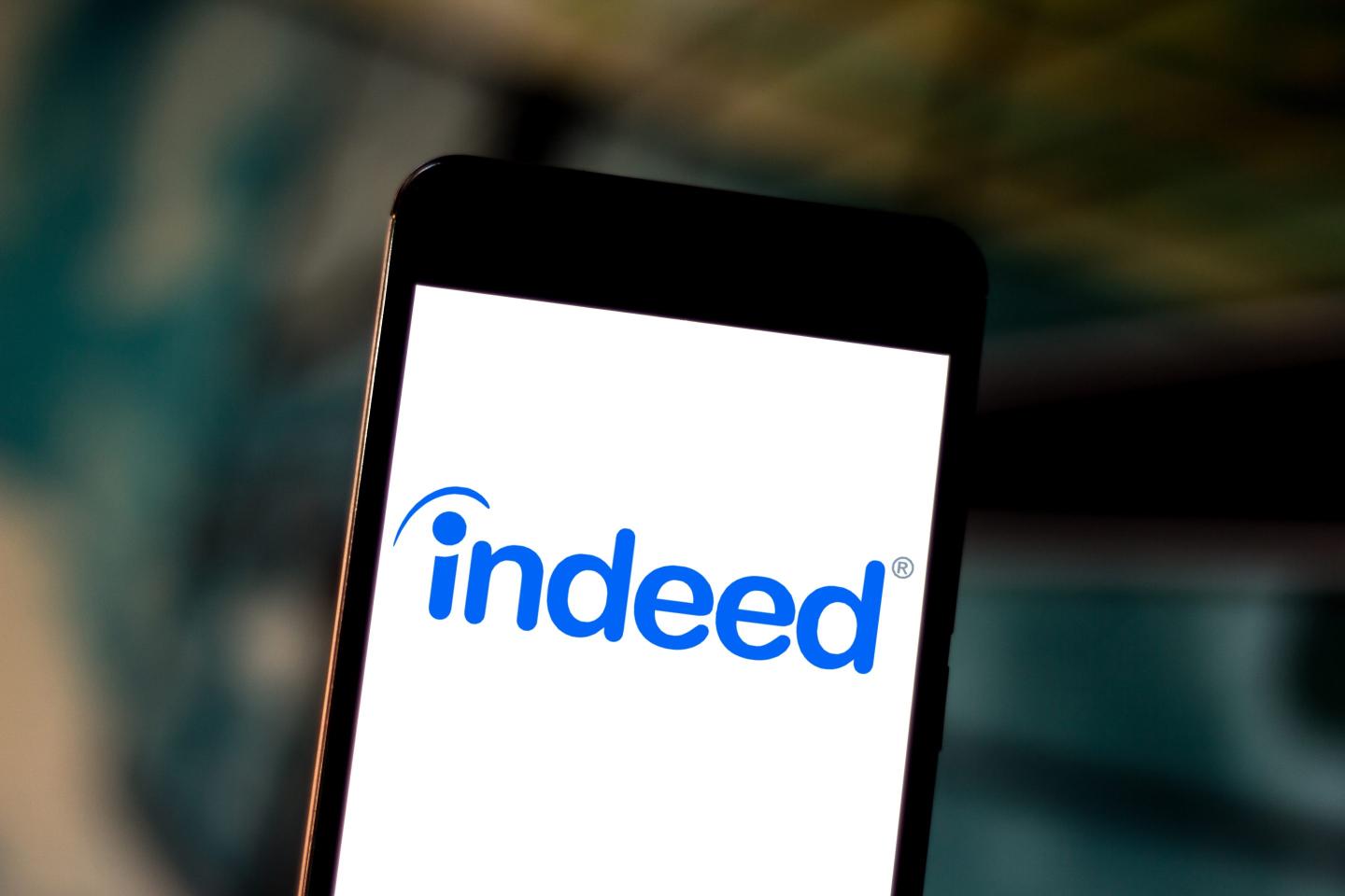 A mobile phone featuring Indeed.com