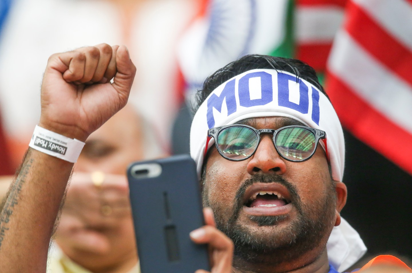 An audience member cheers Indian Prime Minister Narendra Modi