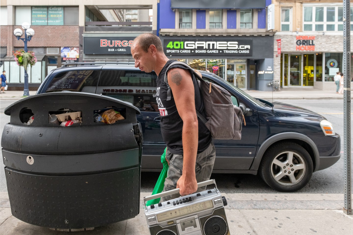 Man holding boomboxes