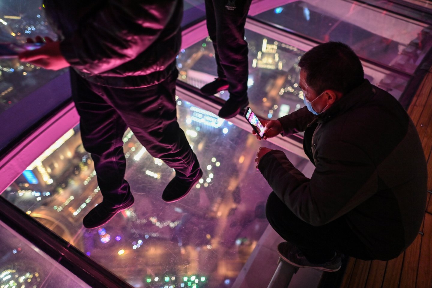 A man in Shanghai using a smartphone