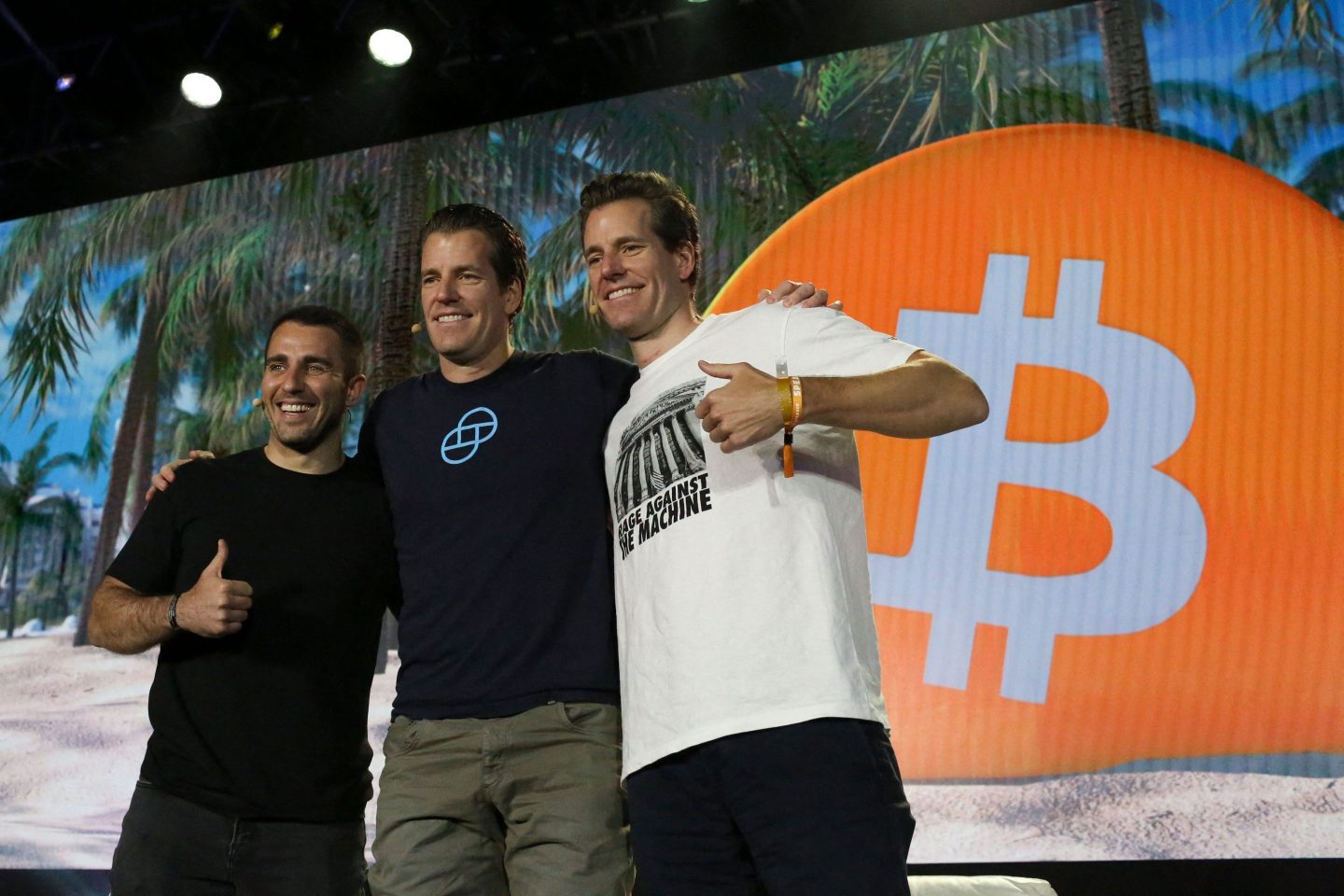 Notable "crypto bros" Tyler Winklevoss, center, and Cameron Winklevoss, right, founders of crypto exchange Gemini Trust, attend the cryptocurrency conference Bitcoin 2021.