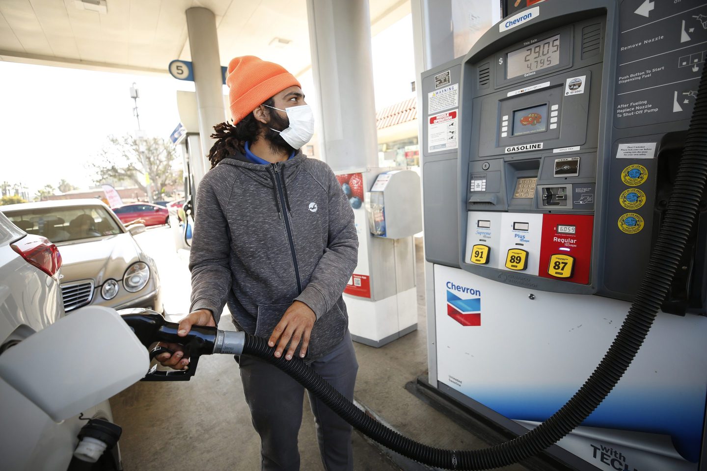 A man pumps his gas in Los Angeles, California.