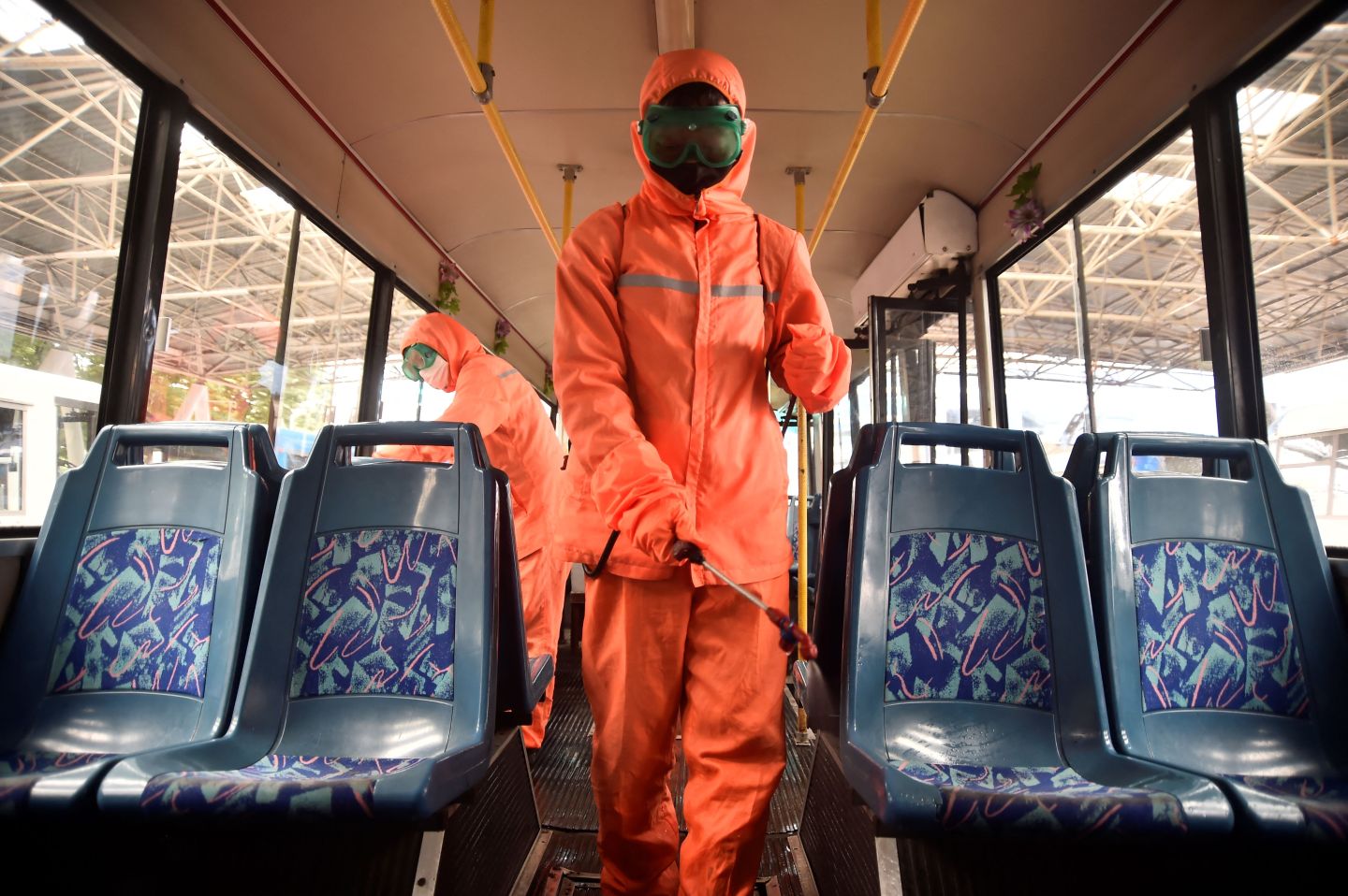 Health officials of the Ryonmot Trolley Bus Office disinfect a trolley bus, as part of preventative measures against the COVID-19 coronavirus in Pyongyang on June 9, 2022. 