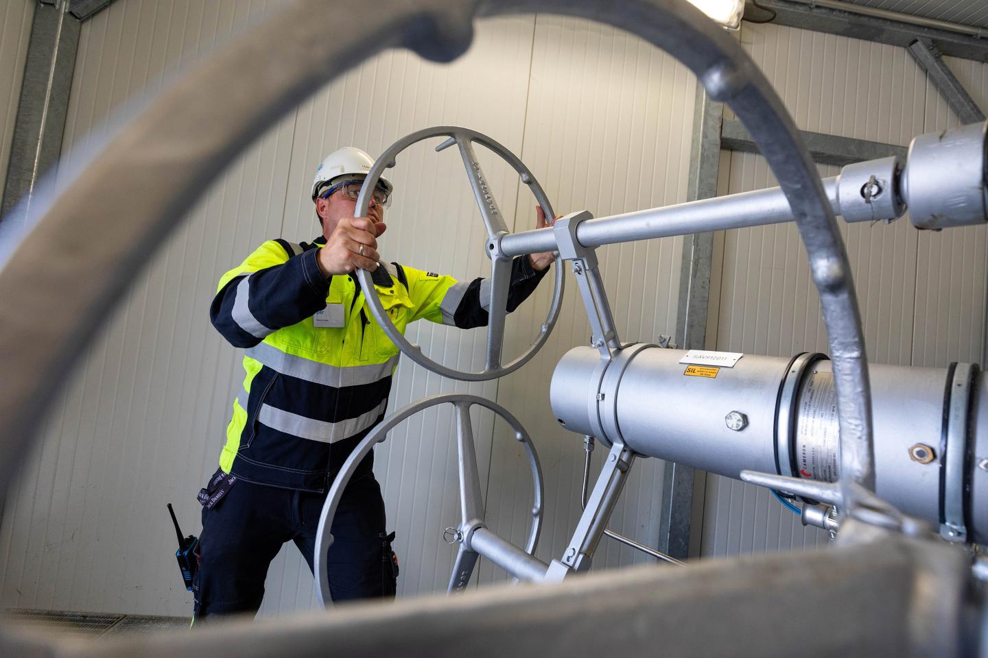 An employee adjusts the control valve of a wellhead at the Uniper SE Bierwang Natural Gas Storage Facility in Muhldorf, Germany, on Friday, June 10, 2022.