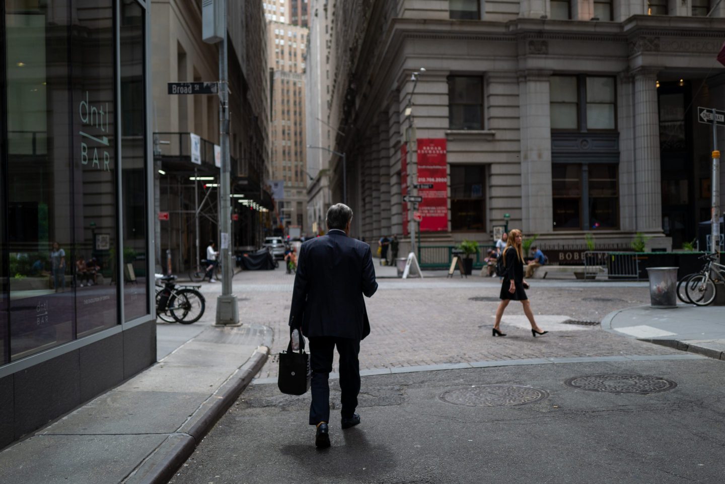 People walk through the financial district in Manhattan on June 14, 2022 in New York City. The Dow was up in morning trading following a drop on Monday of over 800 points, which sent the market into bear territory as fears of a possible recession loom.