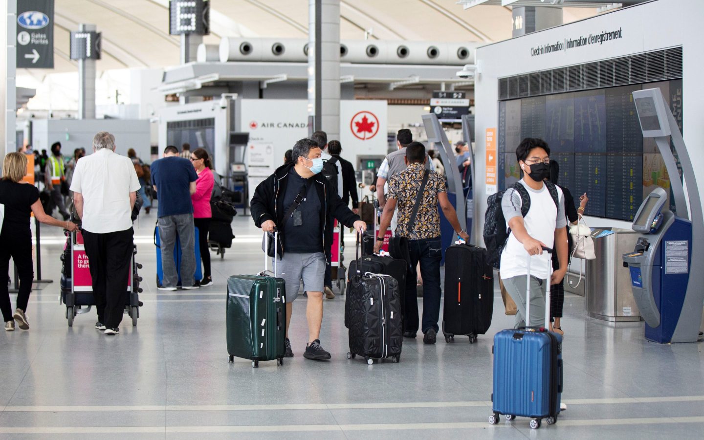 Travelers are seen at Toronto Pearson International Airport in Mississauga, Ontario, Canada, on June 20, 2022. The Canadian federal government started to suspend vaccination requirements against COVID-19 for domestic and outbound travel, federally regulated transportation sectors and federal government employees as of June 20.